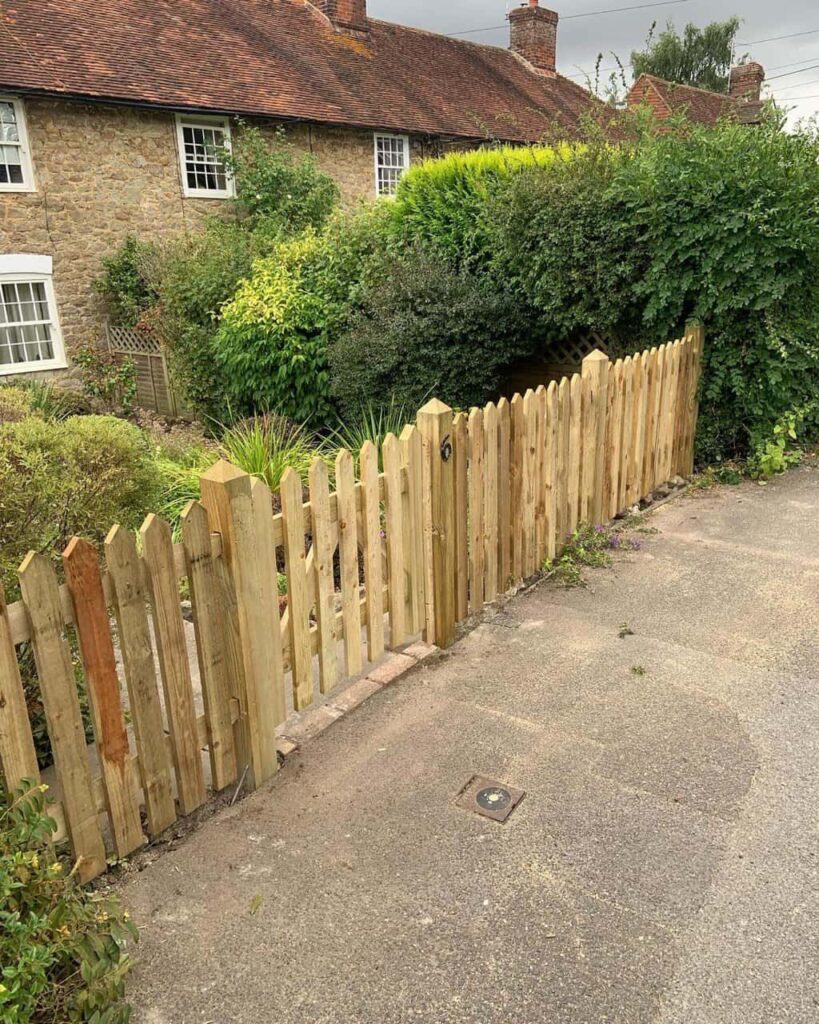 This is a photo of a picket fence and picket gate installed by Fast Fix Fencing Taverham